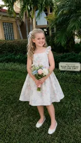 AI-generated glow-up photo of a girl wearing a floral dress and holding flowers